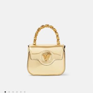 Versace Medusa shiny gold top handle bag